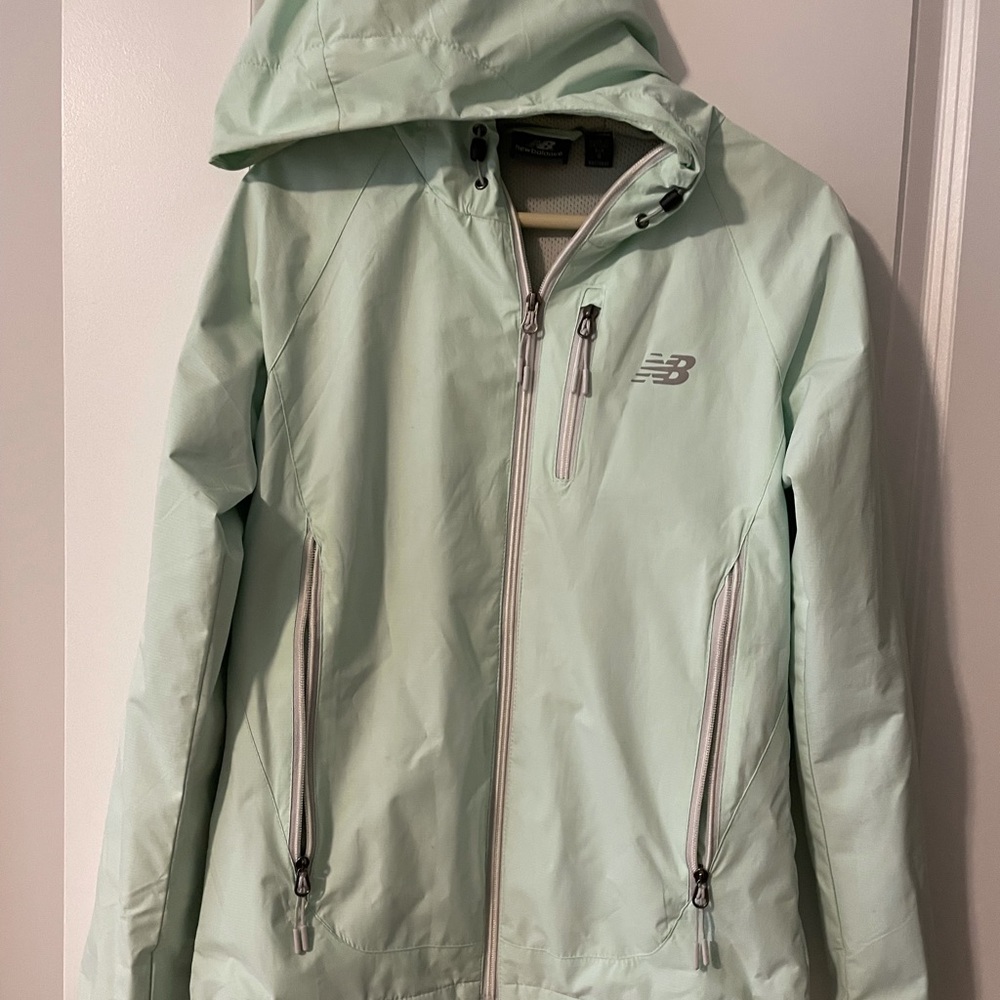 Size S Mint colored New Balance Raincoat. Great condition!
